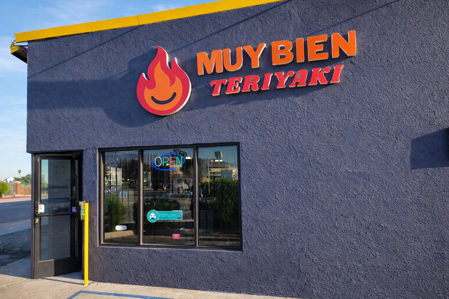 Exterior of the restaurant with logo and "OPEN" sign at Muy Bien Teriyaki, a Japanese Restaurant in El Monte